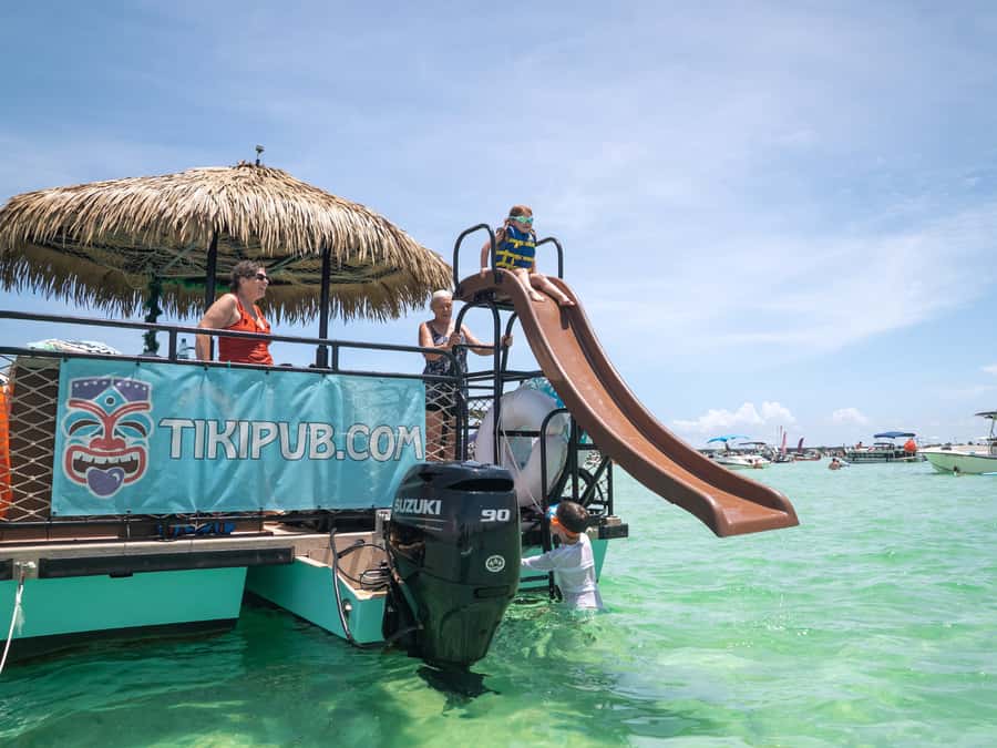 Destin: Tiki Pub Crab Island Sandbar Cruise with Waterslide - Time at the sandbar, water, and slide