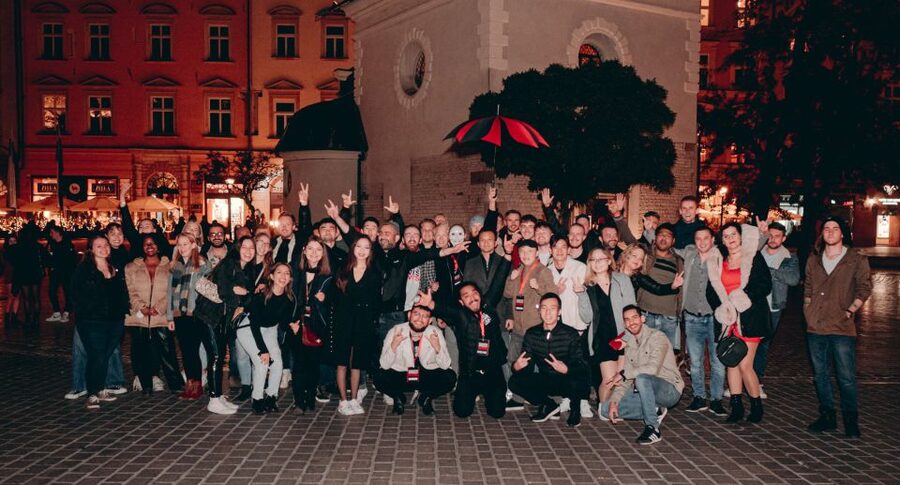 Krakow: Pub Crawl with 1 Hour of Unlimited Alcoholic Drinks - The night begins under the red and black umbrella