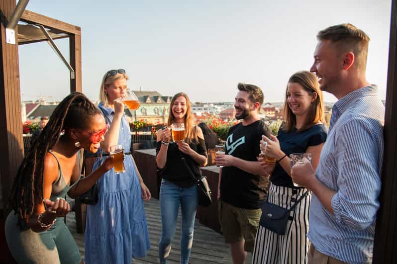 Prague: Local Pub Walking Tour with 5 Beers - Meeting beneath the rotating Franz Kafka head