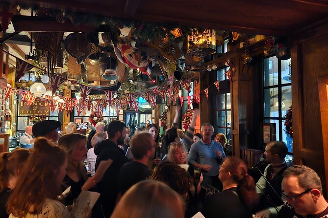 Pub Crawl and Sing along London Experience - British snacks, imported treats, and your own bar bill