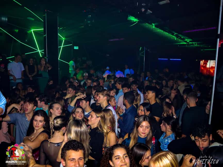 Wild Night Pub Crawl: Free Shots, Games & VIP Club Entry! - Moving through central Madrid bars